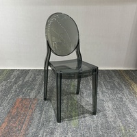 Chaise Ghost en polycarbonate transparent gris fumé pour événements, mariages, chaise de salle à manger d'hôtel à dossier ovale moderne