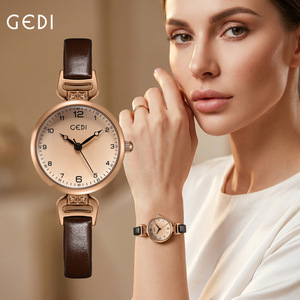 Reloj de cuarzo redondo de oro rosa para mujer GEDI, correa de cuero genuino marrón con pequeños conectores decorativos de cristal, estilo vintage color champán. - Product Image 1