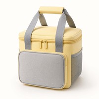 Sac isotherme compact jaune et gris prêt pour l'OEM, avec poche avant et poignée rembourrée pour le travail
