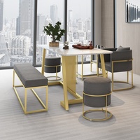 Ensemble table et chaises en marbre de luxe nordique avec structure en fer, personnalisable pour le bureau et la maison