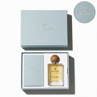 Boîte cadeau de luxe personnalisée avec logo rose en papier spécial, emballage de parfum bleu avec matériaux recyclés, gaufrage artisanal