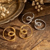 Boucles d'oreilles minimalistes en spirale creuse Gaovo, créoles en acier inoxydable plaqué or 18 carats pour la vente transfrontalière européenne et américaine.