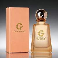 Flacon de parfum personnalisé OEM 100 ml, flacon en verre trapézoïdal avec bouchon à bille doré, emballage en boîte cadeau