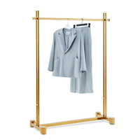 Table et étagères de présentation de vêtements pliables en acier inoxydable doré brillant CAIYI XG19 au design moderne