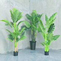 Vente en gros de paradis d'oiseau de plante verte de simulation avec la banane et l'arbre artificiel de bonsaï de voyageur pour la décoration d'intérieur