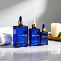 Vente en gros de flacons de parfum vides haut de gamme bleus 30ml 50ml 100ml, flacon de parfum carré en verre transparent