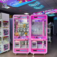 En gros, Machine à griffes à monnayeur Naughty Dog pour jeux d'enfants, avec jouets en peluche et poupées, rose transparente, pour arcade, 110V/220V, Version anglaise pour magasins