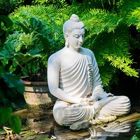 Marble Buddha Statue in garden and nature