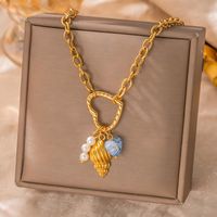 Collier en acier inoxydable plaqué or 18 carats sur le thème de l'océan, pendentif étoile de mer, perle, coquillage, design étoile pour femme - Cadeau, usage quotidien