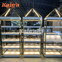 Vitrine à bijoux en verre avec cadre doré luxueux, éclairage LED, présentoir intelligent pour lunettes, adapté aux boutiques et centres commerciaux