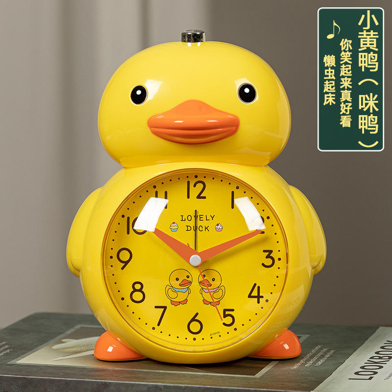Patito amarillo con carita amarilla + despertador con melodía.