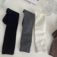 Chaussettes hautes polyvalentes en tricot noir uni respirantes et antidérapantes pour femmes, style flatteur pour les jambes, automne/hiver