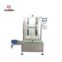Machine de remplissage gravimétrique pour engrais liquides agricoles, lubrifiants et fûts de produits chimiques industriels