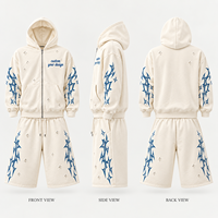 Ensemble deux pièces en molleton de coton épais pour homme, veste à capuche zippée et short avec imprimé graphique pour un style streetwear