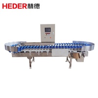 Weeg- en sorteermachine. Apparatuur voor het wegen en sorteren van oesters, kippenpoten, kippenvleugels, fruit, vlees en zeevruchten.