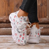 Les nouvelles baskets décontractées à motif graffiti fraise sont des baskets décontractées et confortables à semelle épaisse et à lacets sur le devant