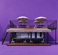 Commande en gros de maisons conteneurs préfabriquées à deux étages, y compris balcon en verre et terrasse en bois, pour cabanes de station balnéaire en montagne