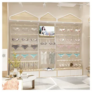 Women's clothing store clothing display racks lingerie display racks against the wall with lights racks