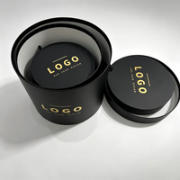 Boîte à chapeau ronde en forme de fleur avec couvercle, boîte cadeau cylindrique en papier noir mat avec logo en feuille d'or et poignée en ruban, taille et couleur personnalisées