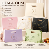 Boîte cadeau en papier personnalisée avec logo imprimé OEM, couleurs et tailles disponibles sur mesure, pour l'emballage de produits quotidiens et de marchandises.