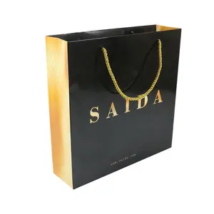 Sac en papier brillant noir de luxe avec logo personnalisé Vente en gros au détail Cadeau artisanal Bijoux cosmétiques