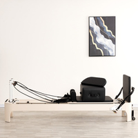 Lit d'entraînement de Pilates portable personnalisé, blanc, en bois arrondi, avec lit de Pilates confortable pour le renforcement du tronc