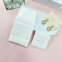 Pochette à bijoux noire ZXF, prix abordable, emballage en microfibre à fermeture pression pour boucles d'oreilles avec logo