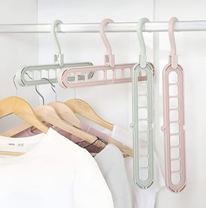 Estante de Almacenamiento Multifuncional de Plástico con Nueve Orificios, Percha Mágica Plegable para Ropa - Product Image 1