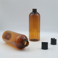 Bouteille en plastique PET ambrée en forme de balle de 16 oz, 12 oz, 8 oz avec bouchons à disque noir lisse pour l'emballage de shampoing, gel douche, lotion, huile