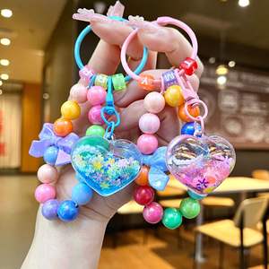 Porte-clés personnalisé avec perles et paillettes liquides, cœur et nœud arc-en-ciel, sangle de téléphone Kawaii pour filles, cadeau d'anniversaire pour adolescentes, vente en gros - Product Image 2