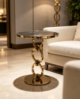 Table d'appoint de luxe italienne à anneaux, plateau en marbre noir et or, table d'appoint artistique pour salon de villa