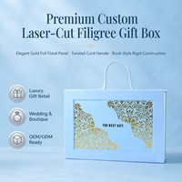 Boîte cadeau rigide personnalisée découpée au laser, motif floral bleu poudré avec feuille d'or, poignée en cordon torsadé, style livre