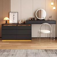 Bureau de toilette moderne noir avec plateau en verre, éclairage LED intégré, plusieurs tiroirs et armoire latérale pour chambre à coucher
