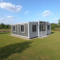 Maison pliante portable Maisons préfabriquées en acier Maison de conteneur modulaire pour la vie et la solution de conteneur d'immeuble de bureaux personnalisable