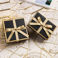 Boîte cadeau rigide noire élégante avec paillettes, bordure dorée, ruban en satin, nœud, boîte cadeau pour parfum, ensemble de soins de la peau, emballage cadeau pour les fêtes