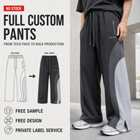 Pantalon de survêtement en molleton français à blocs de couleur personnalisés, coupe large avec ourlet fendu, pour hommes, marque privée pour tenues streetwear