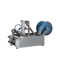 Machine d'étiquetage semi-automatique manuelle de haute qualité pour bouteilles rondes et sachets