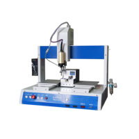 Machine de serrage automatique des vis pour assemblage de claviers d'appareils électroménagers avec double plateforme et aspiration sous vide