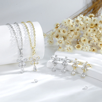 Joyería de moda chapada en oro 14K cobre chapado en oro circón mini flor gota de agua collar pendientes conjunto de dos piezas al por mayor