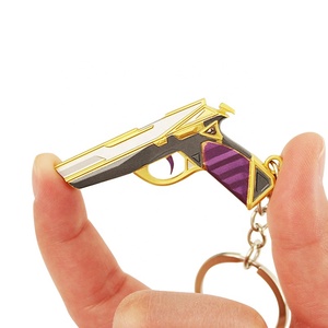 Llavero Clásico Prime de Valorant, Diseño Dorado y Morado con Grabado en Relieve, para Colección de Gamers y Pequeño Regalo Navideño - Product Image 1