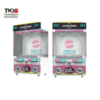 Machine à grue à double poste avec espace de rangement extra large, conception adaptée aux enfants, hauteur personnalisable pour la distribution interactive de jouets en boîte surprise