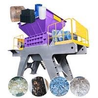 Déchiqueteur robuste à double arbre pour déchets plastiques, palettes, conteneurs IBC, pare-chocs, filtres à huile et fûts de tonne