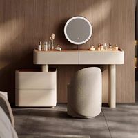 Ensemble coiffeuse moderne en cuir avec miroir de maquillage rond à LED, armoire de rangement à tiroirs et tabouret bouclé pour chambre à coucher