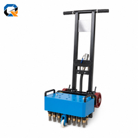 Machine à scarifier le béton motorisée pneumatique à poussoir QS, haute efficacité, pour le dégrossissage des sols, le revêtement des tunnels et le décapage des dalles.