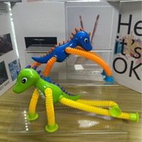 Jouet de soulagement du stress en plastique à ventouse, tube télescopique polyvalent, dinosaure de dessin animé, nouveauté