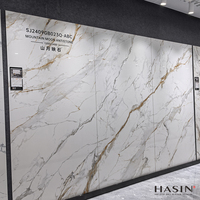 Carreaux de dalle de porcelaine de sol en pierre frittée brillante bon marché 1200X2400mm Grande dalle de pierre artificielle en marbre de luxe de 9mm pour comptoir