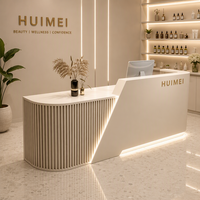 Comptoir de réception minimaliste incurvé avec éclairage LED pour salon de beauté de luxe, spa, boutique, magasin ou bureau