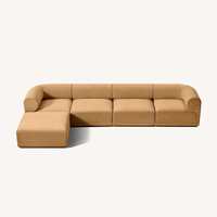 Canapé modulaire contemporain à profil bas avec accoudoirs cylindriques rembourrés et chaise longue sectionnelle