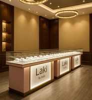 Vitrine à bijoux en métal doré avec logo personnalisé, éclairage LED, design moderne et écologique pour les magasins de bijoux commerciaux