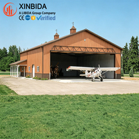 Hangar préfabriqué en acier à haute clarté, terminal d'entretien aéronautique, grand espace intérieur, forte capacité de charge, assemblage rapide par boulons